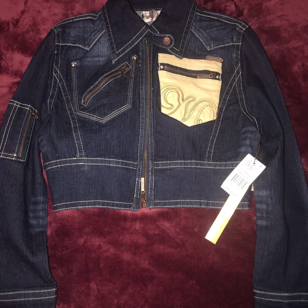 Cropped jean jackets with cream colored designs